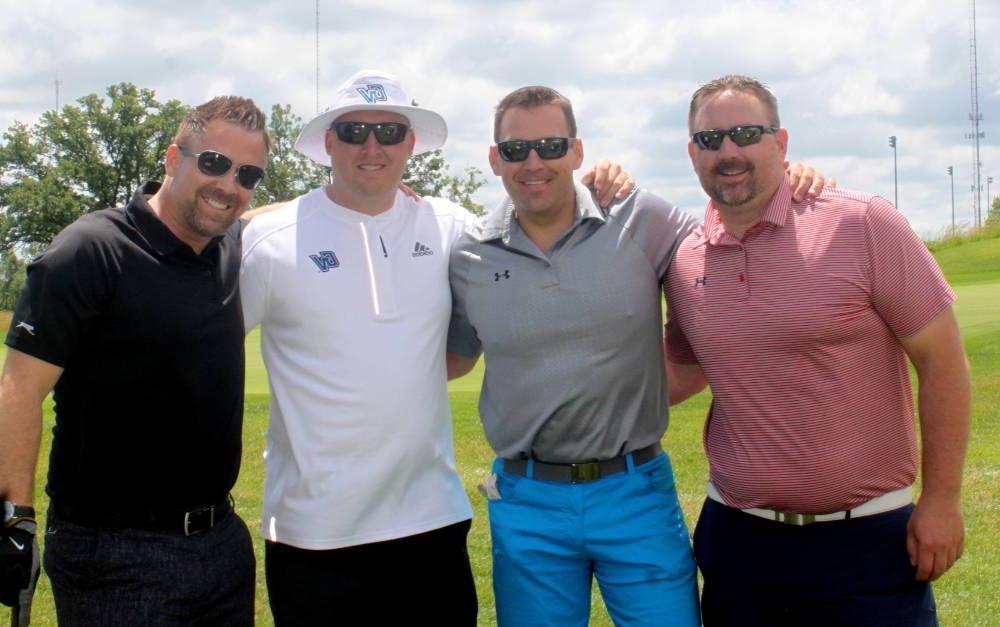 4 alumni men play golf